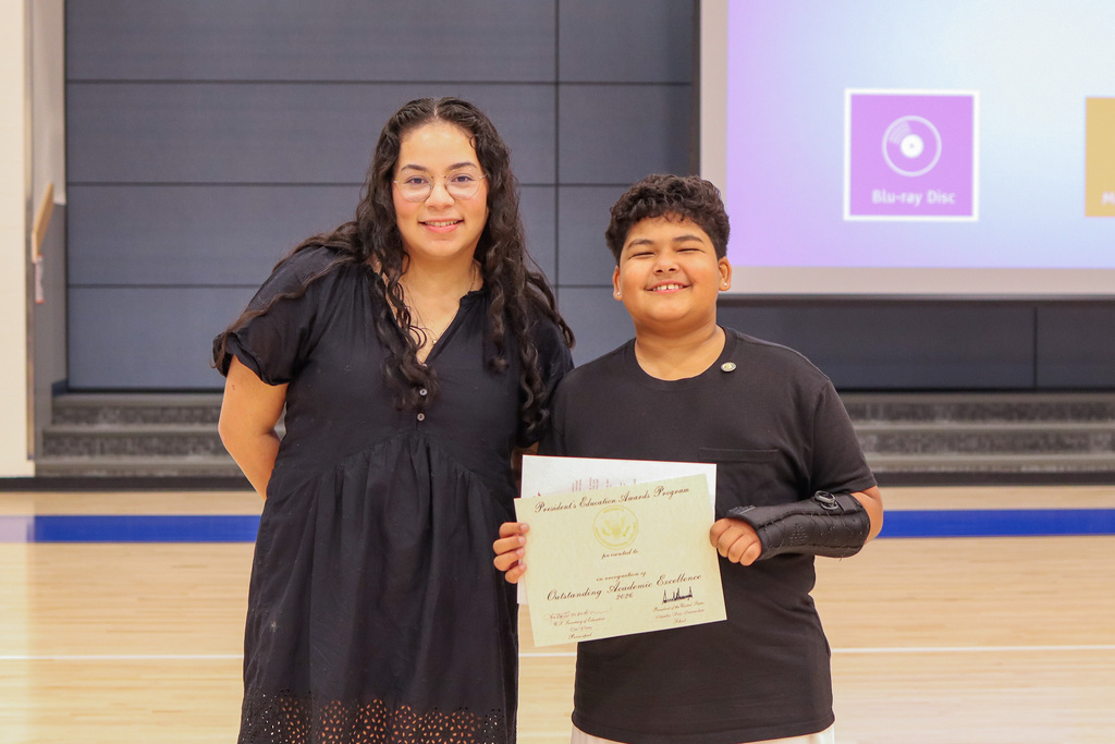 Photo of student with teacher