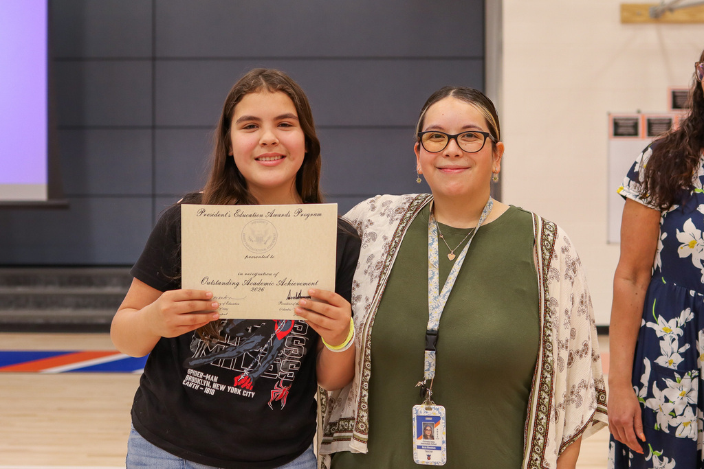 Photo of student with teacher