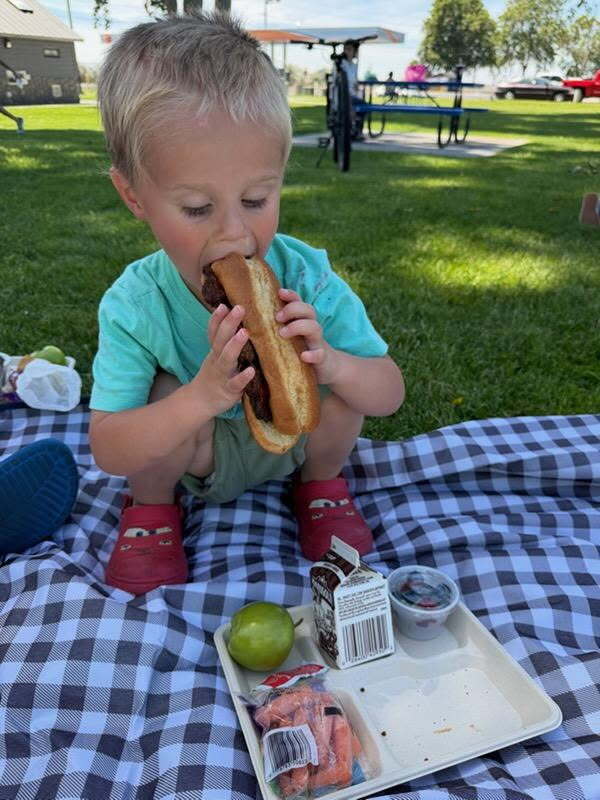 child enjoying summer meal 
