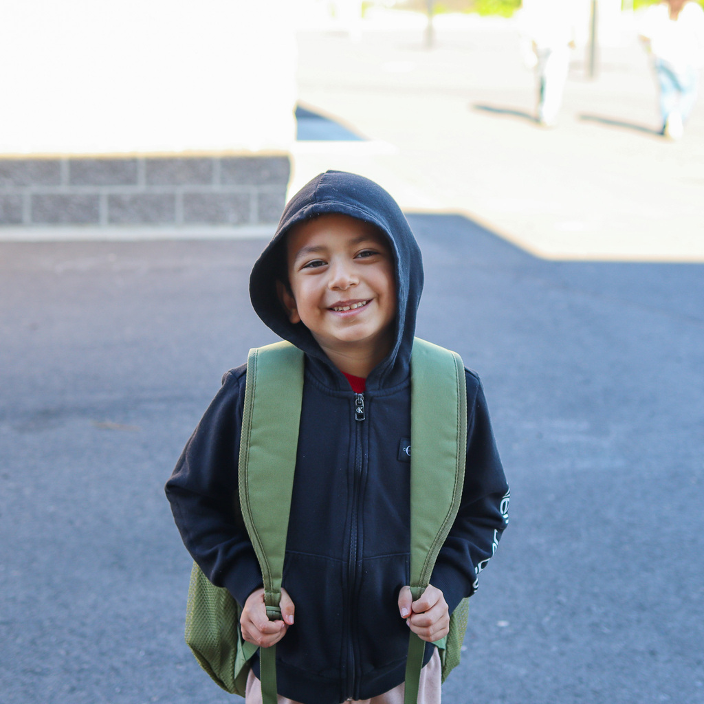 student posing for a photo on the playground
