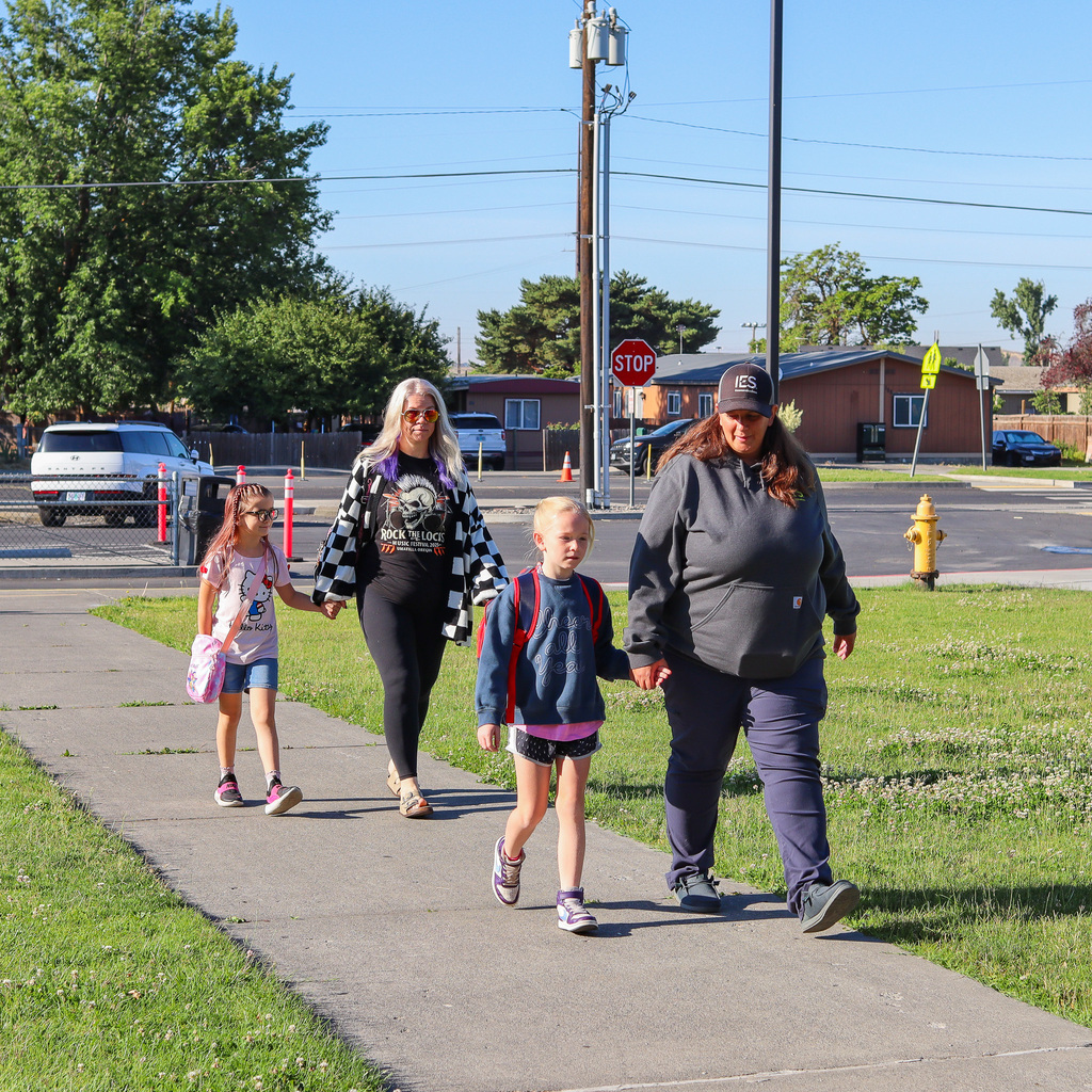 Parents and students walking to the playground