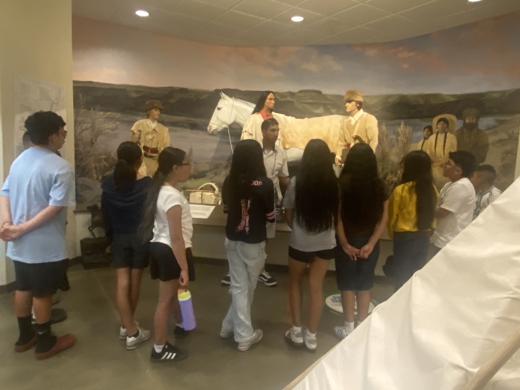 Students listening to tour guide 
