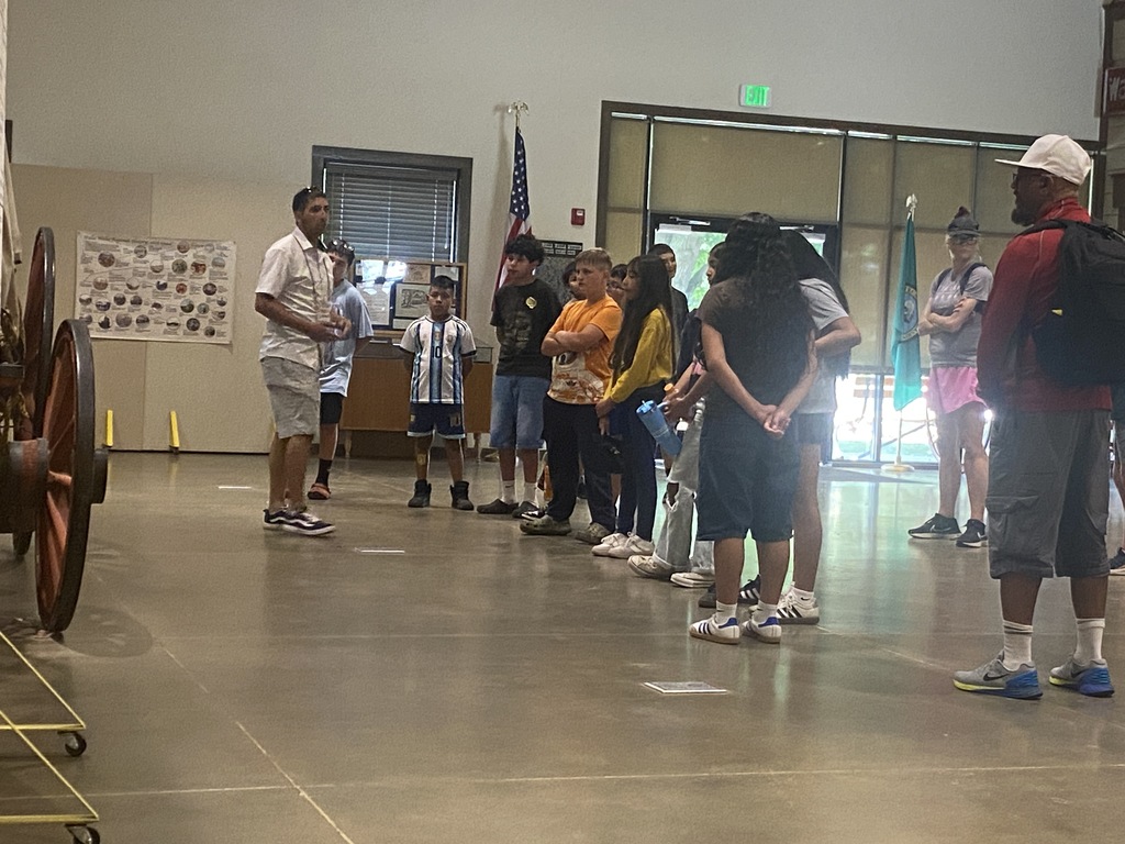 students listening to tour guide 