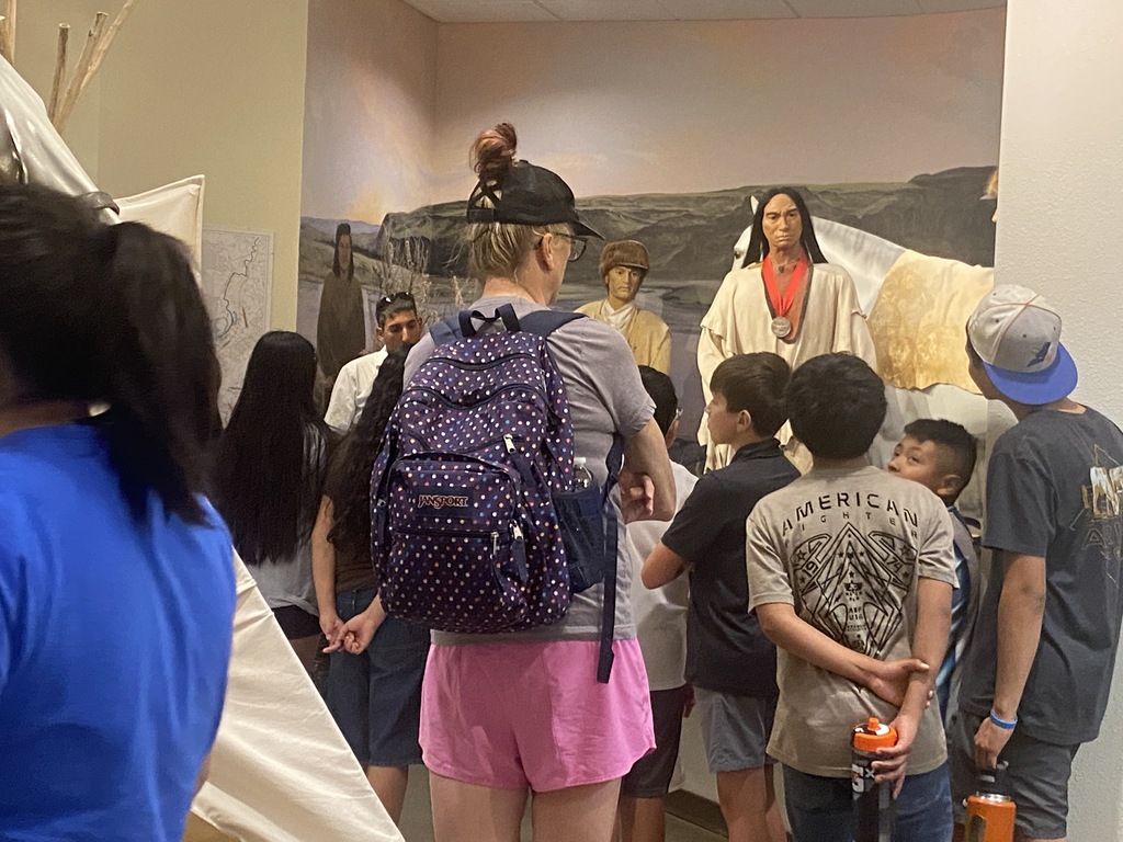 students listening to tour guide 