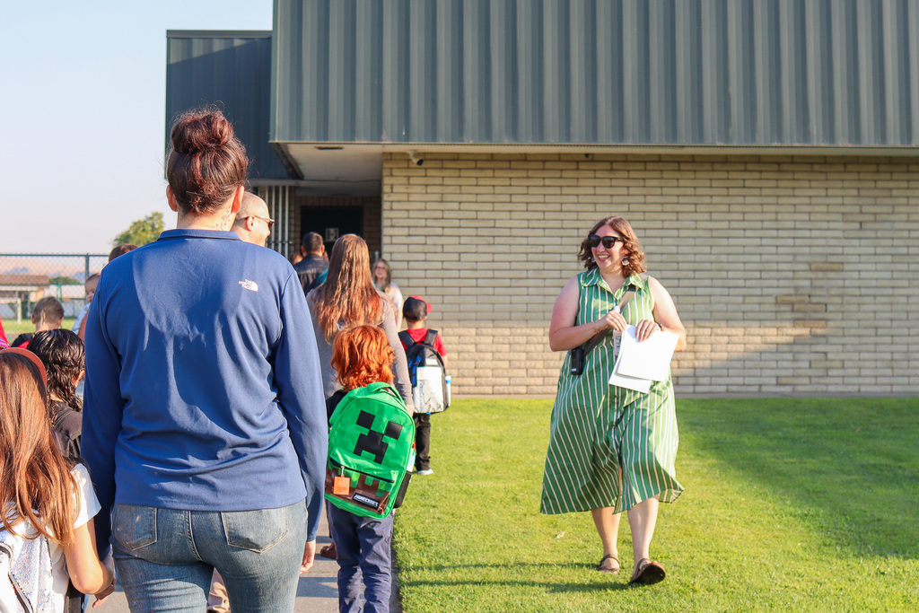 Principal Mrs. Lorence welcoming students and families back to school 