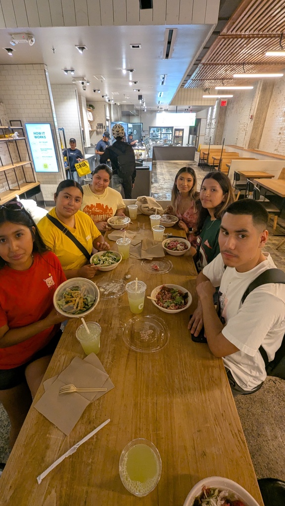 Students enjoying food at one of the local resturants they visited