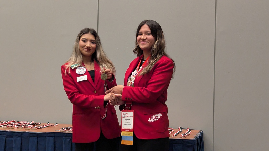 Joana awarding Jocelyn a gold medal for her project