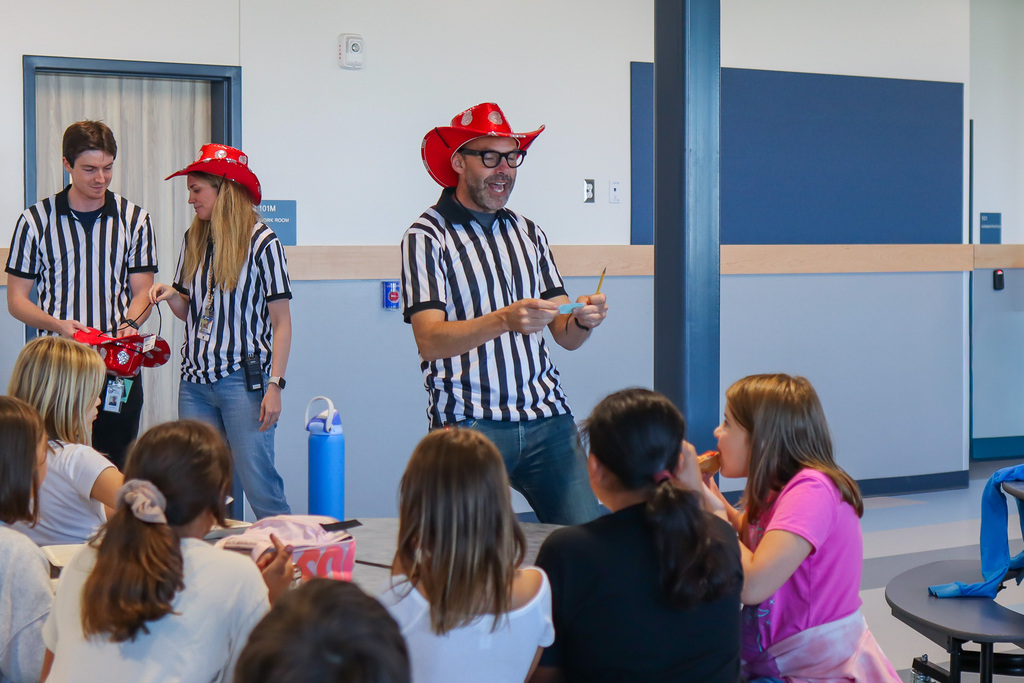 Principal Young announcing which student's ticket was drawn