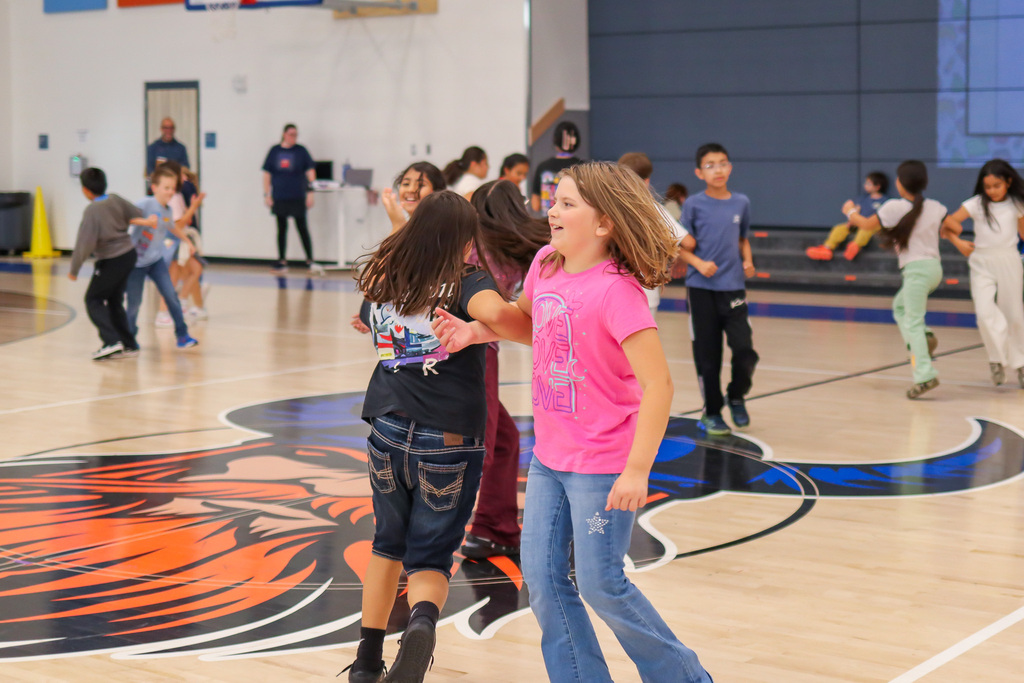 Students dancing La Raspa in PE/Music for National Hispanic Heritage Month