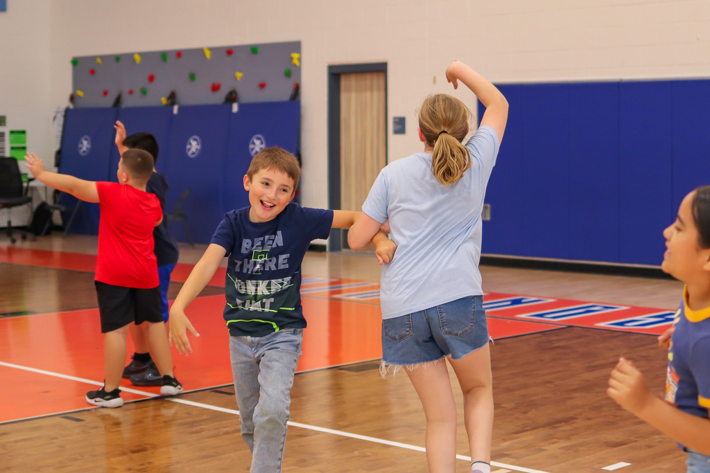 Students dancing La Raspa in PE/Music for National Hispanic Heritage Month