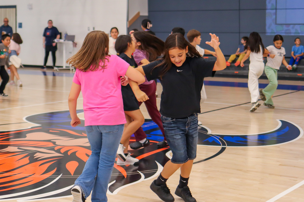 Students dancing La Raspa in PE/Music for National Hispanic Heritage Month