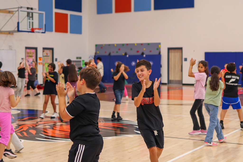 Students dancing La Raspa in PE/Music for National Hispanic Heritage Month