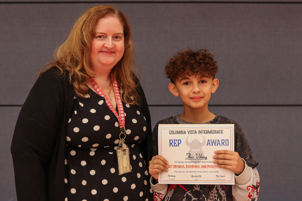 Photo of Mrs. May and her 6th grade REP Award winner.