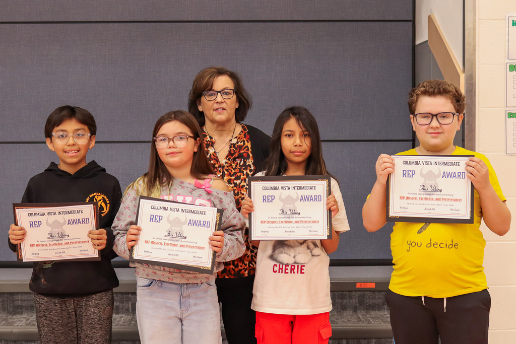 Photo of 5th Grade Teacher Mrs. Estrella and her REP Award winners