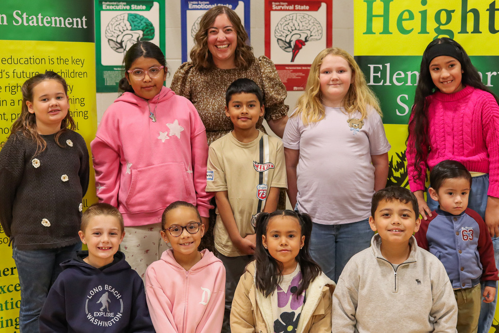 Photo of Vice Principal Ms. Lorence with 2nd and 3rd grade behavior award winners