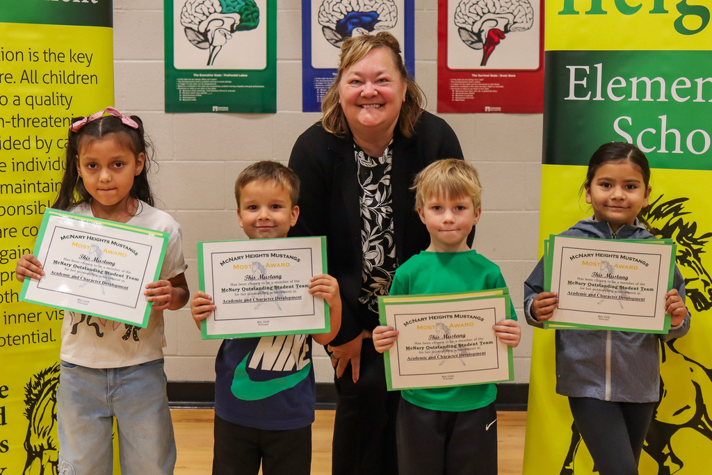 Photo of PE teacher Mrs. Lorence with her kinder and 1st grade MOST award winners