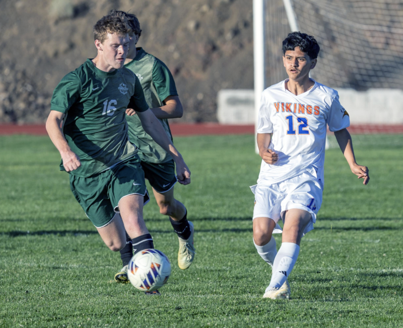 Photo by Kathy Aney Pendleton's Liam Clark (16) attempts to change direction as Umatilla's Brayden Nava (12) defends on Sept. 8, 2026, in a non-league game in Pendleton.