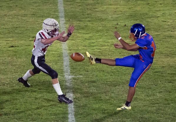 Photo by Kathy Aney Mac-Hi's Thomas Hoel attempts to interrupt the kick of Abrahan Garcia on Oct. 9, 2025, in Umatilla. Hoel blocked the kick but got called for roughing the kicker.