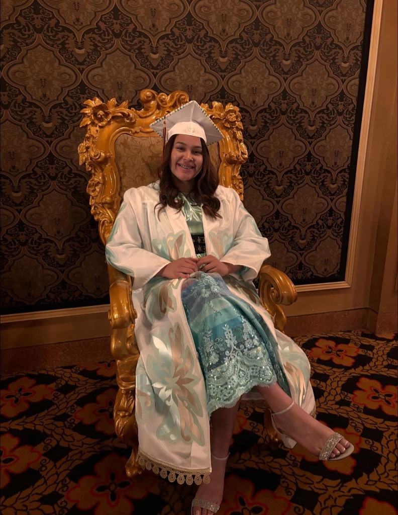 Desma Walker dressed in full graduation gown, on the set of "Best in Class"