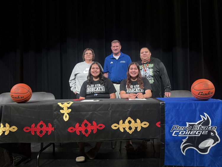 Desma, Dailene, and family with Peru State Athletics staff