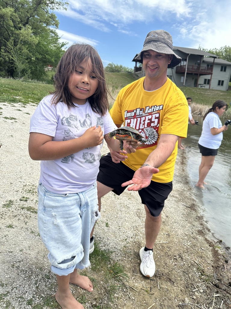 Student holding a turtle