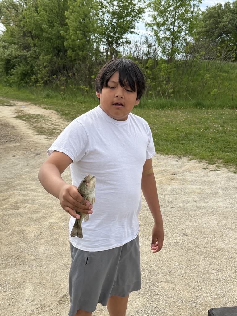 Student holding a fish they caught!