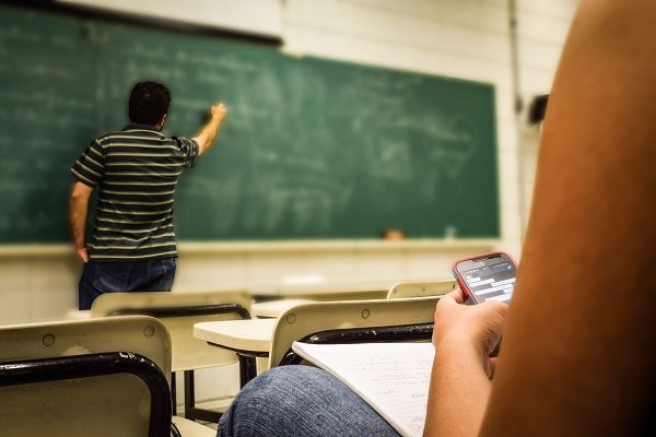 A student texting in class