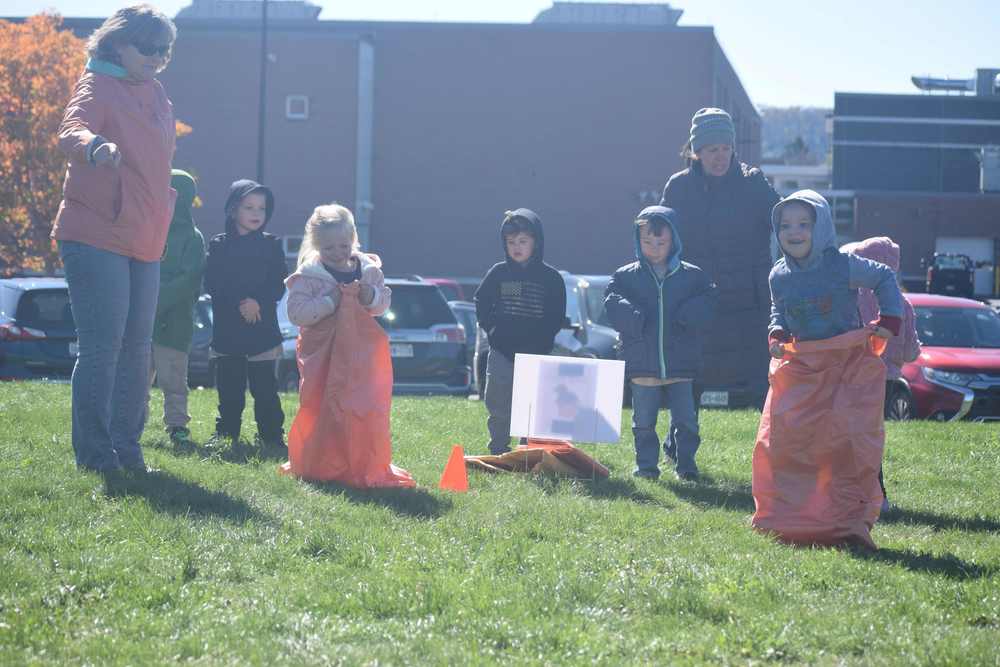 students have a sack race