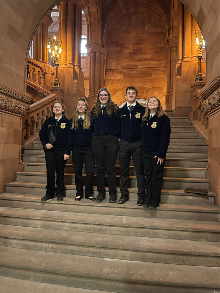 Students stand in the state capitol