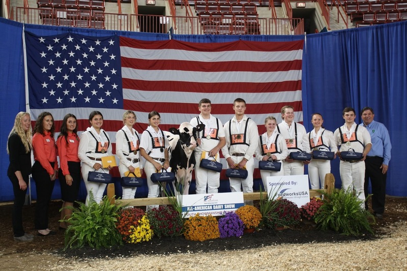 winners stand on stage
