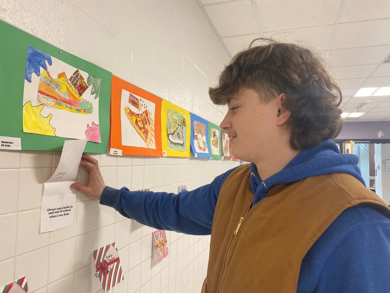 A student looks at a card
