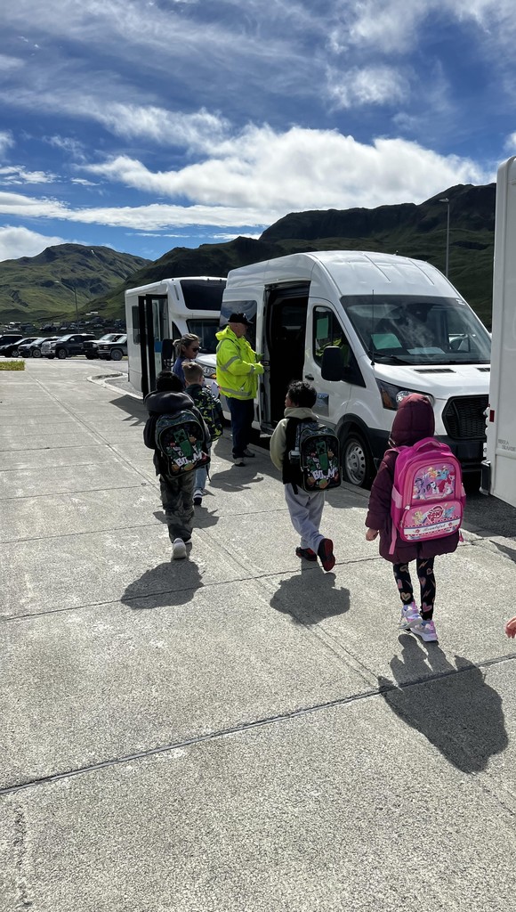 Students loading school vehicle