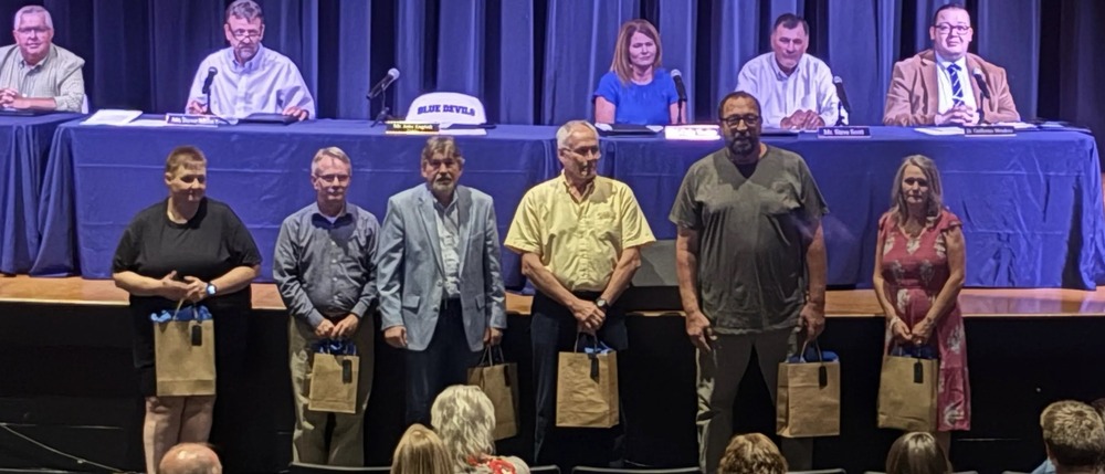 Retirees lined up for a photo