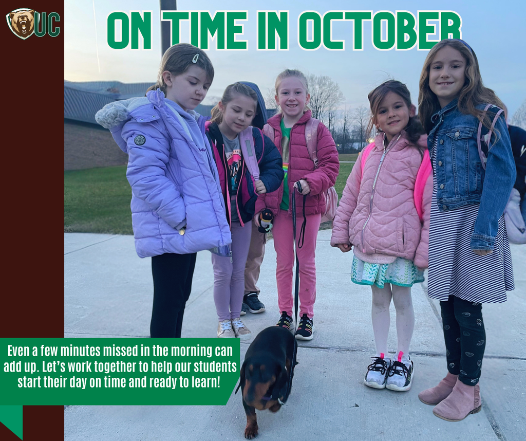 Students coming to school, while saying hi to our therapy dog, Lucy.