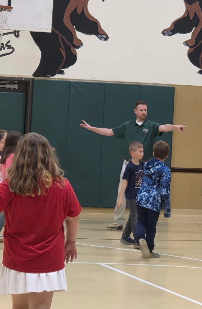 3rd Grade playing basketball with the principal.