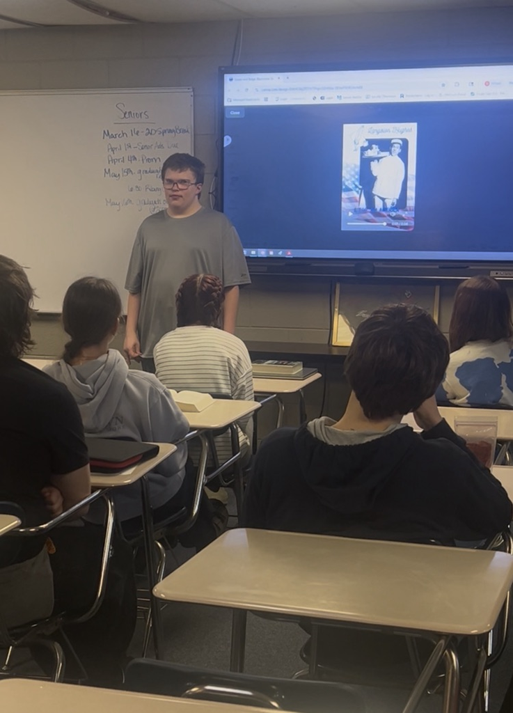 Kyle presenting his poem and slide