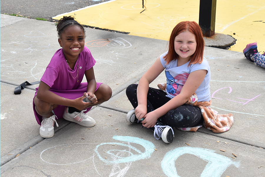 students drawing with chalk