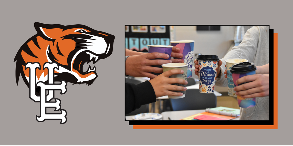 U-E Middle School Students holding cups of hot chocolate