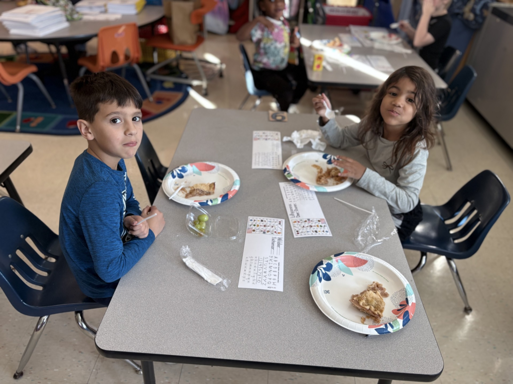 Elementary students enjoying homemade apple treats