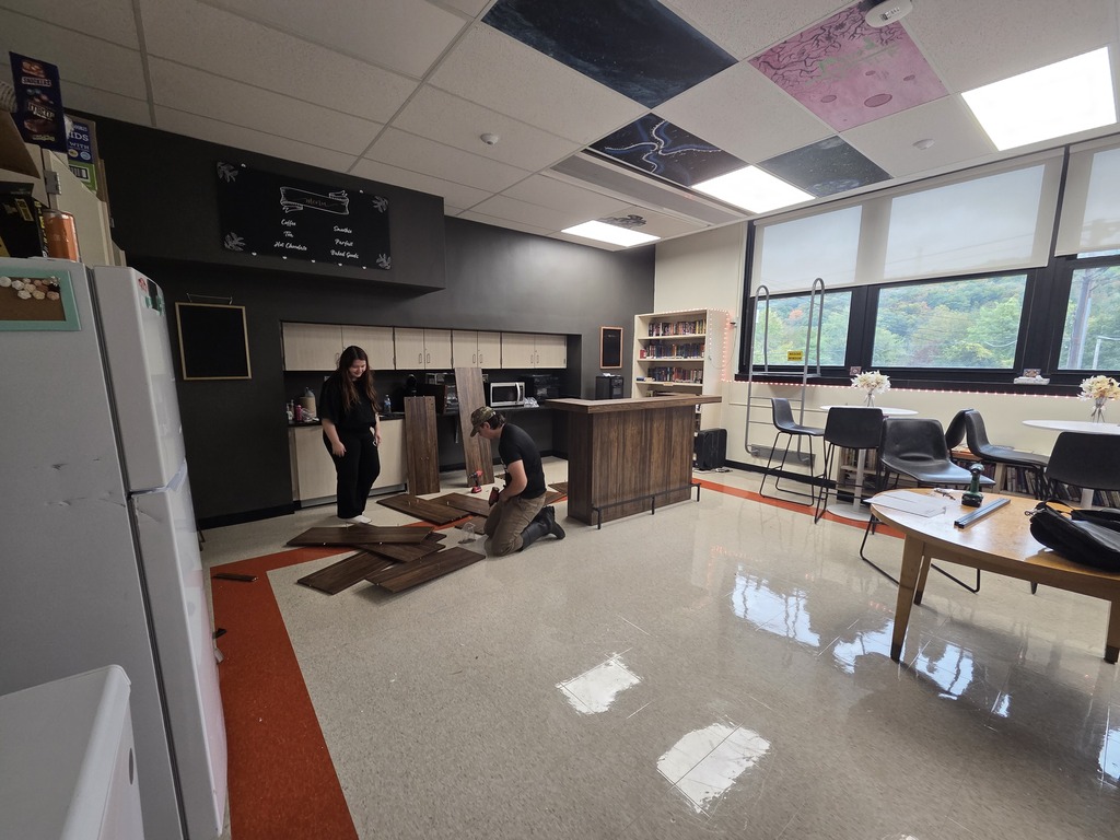 Tiger Venture students building the interior of the drip and sip cafe