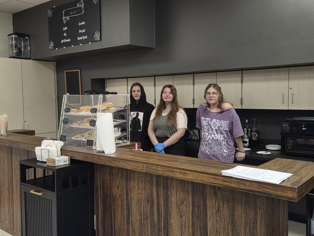 Three Tiger Ventures stuents behind the counter at Drip and Sip cafe
