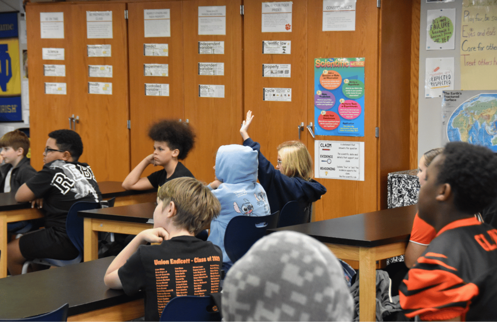 JFS students raising their hands to ask UEHS students questions
