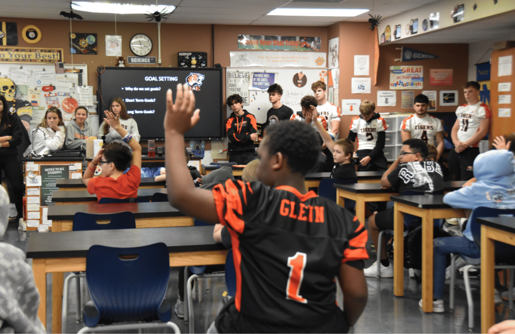 JFS students raising their hands to ask UEHS students questions