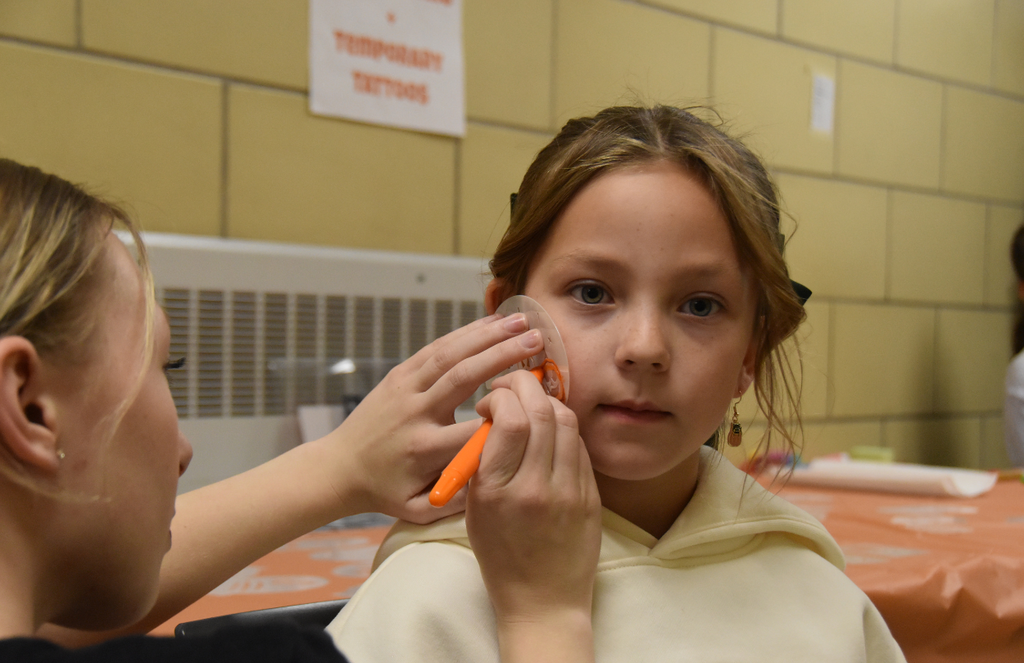 A student is getting a face painting