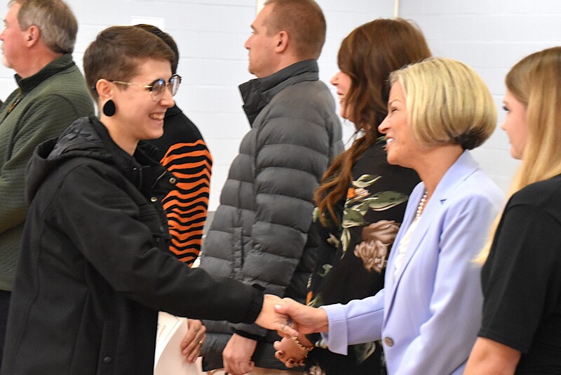JFS staff member shaking hands with board member.
