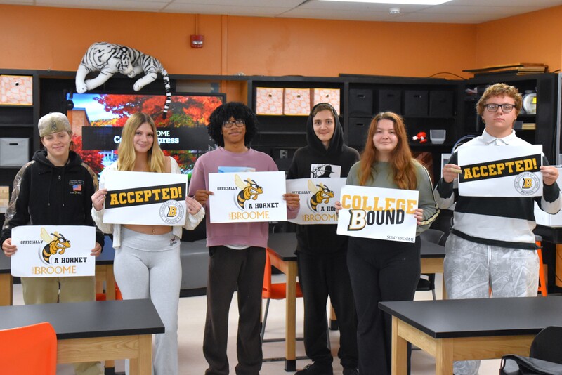 Seniors at Tiger Ventures holding acceptance letters from SUNY Broome