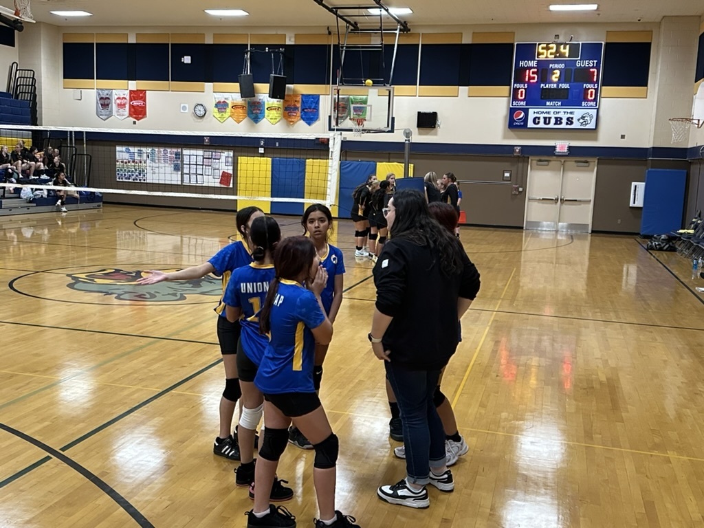 Girls' Volleyball Team Huddle