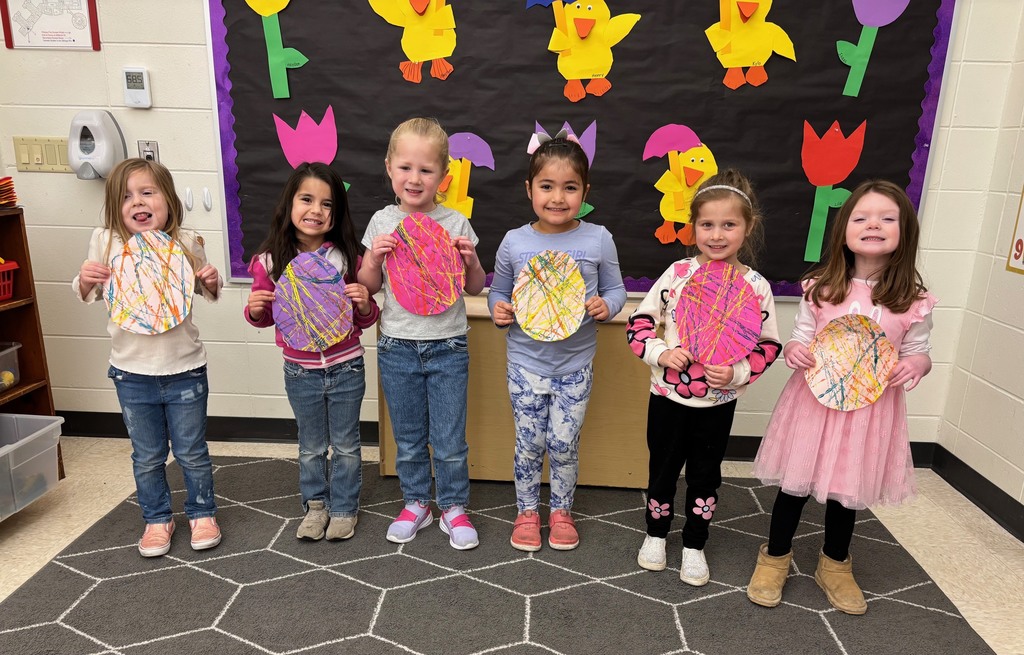 4k students with painted paper eggs