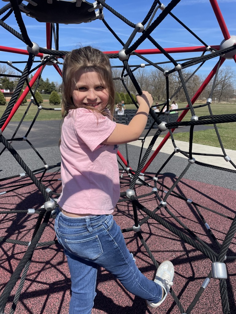 a girl smiles at the camera