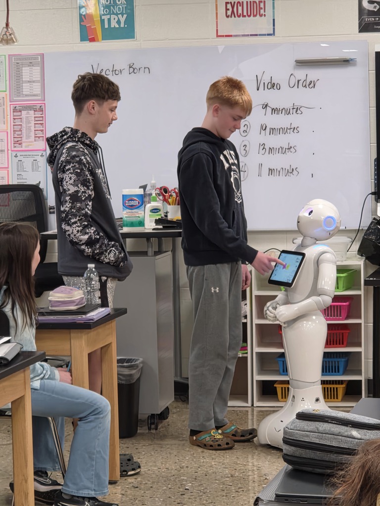 students interacting with a robot
